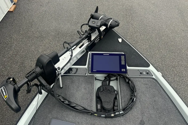 Slide: The Image of 2025 Phoenix 721 ZXL boat deck with trolling motor and electronic display. - 6