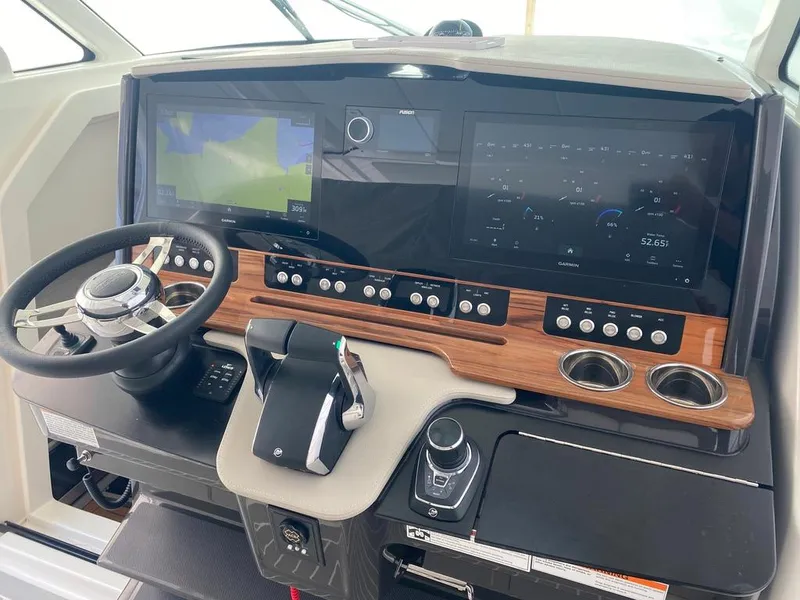 Slide: The Image of 2023 Tiara Sport 38 LS helm with advanced navigation and control systems. - 13