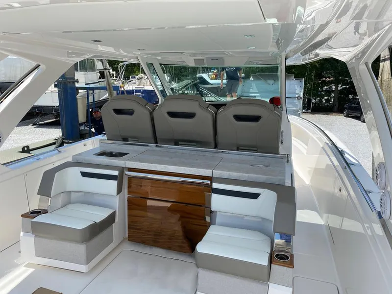 Slide: The Image of 2023 Tiara Sport 38 LS luxury boat interior with seating and sleek design. - 9