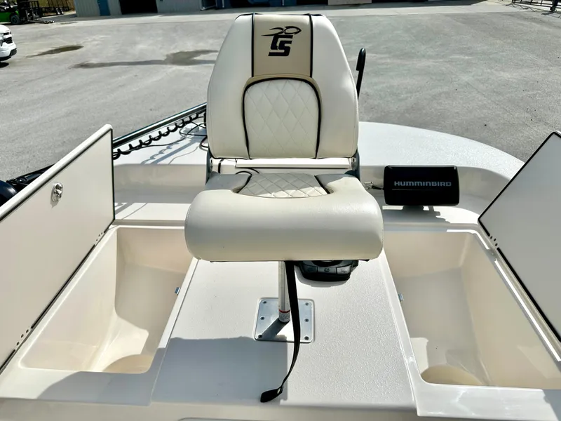 Slide: The Image of 2021 Carolina Skiff 21 LS boat seat with storage compartments and Humminbird equipment. - 14