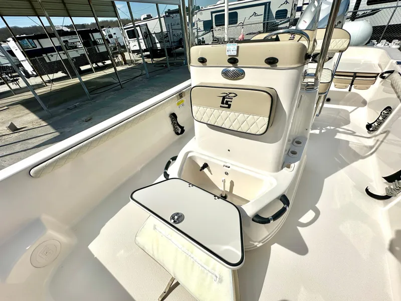 Slide: The Image of 2021 Carolina Skiff 21 LS boat interior with open storage compartment. - 9