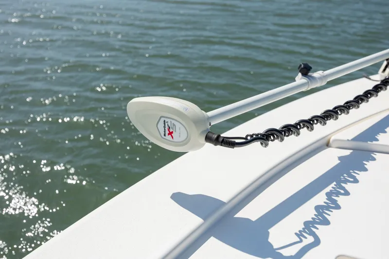 Slide: The Image of 2023 Pathfinder 2300 HPS boat with trolling motor on calm water. - 12