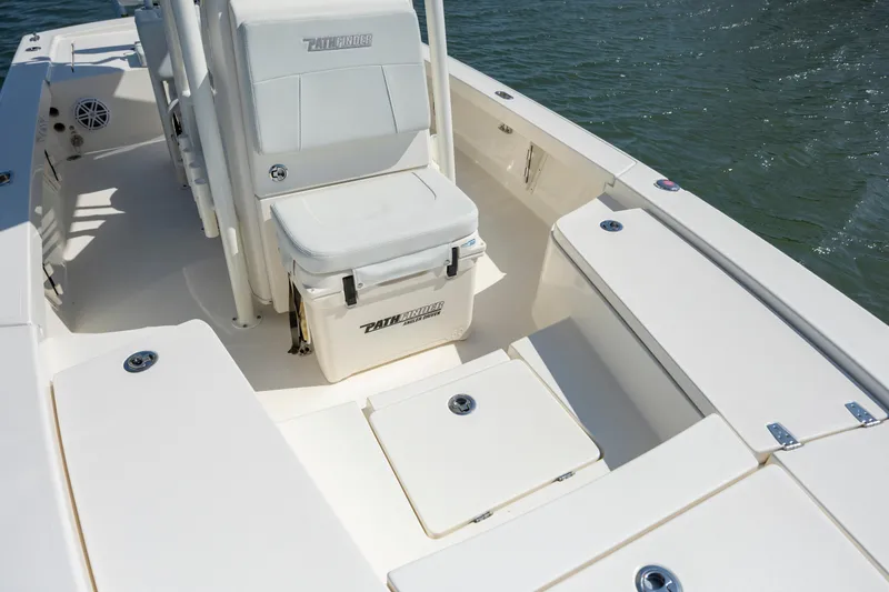 Slide: The Image of 2023 Pathfinder 2300 HPS boat interior with seating and storage compartments. - 15