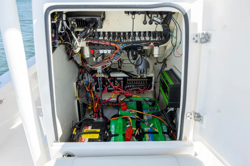 Slide: The Image of Electrical compartment of 2023 Pathfinder 2300 HPS boat with wiring and batteries. - 17