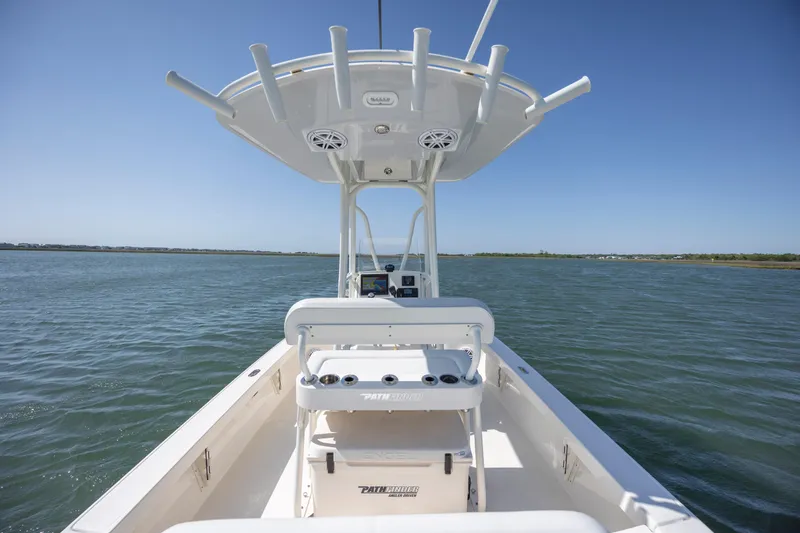 Slide: The Image of 2023 Pathfinder 2300 HPS boat on water, featuring center console and T-top. - 23
