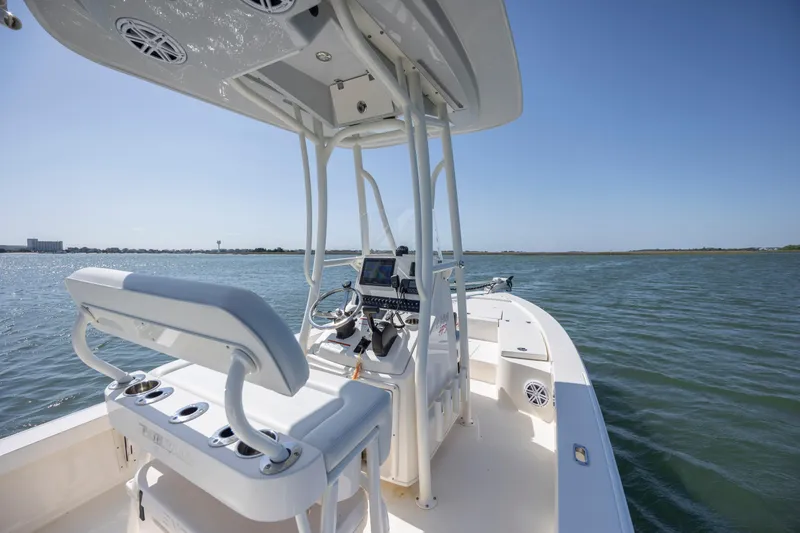 Slide: The Image of 2023 Pathfinder 2300 HPS boat on water, featuring sleek design and modern controls. - 25