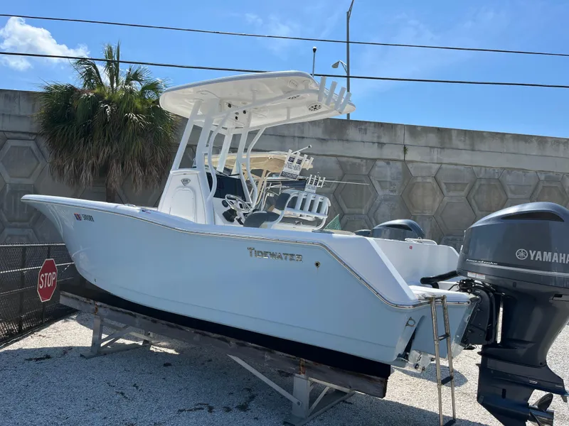 The Image of 2018 Tidewater 232 CC Adventure boat with Yamaha engines, displayed outdoors on a sunny day. - 1