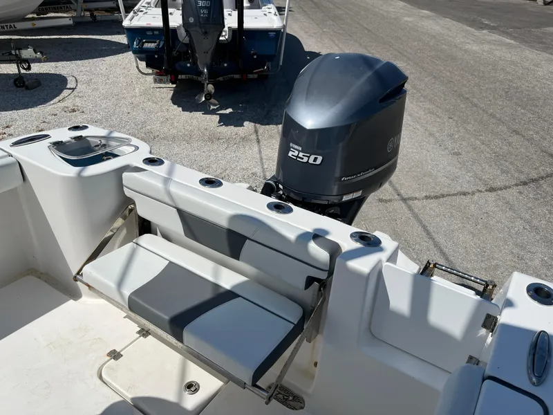 Slide: The Image of 2018 Tidewater 232 CC Adventure boat with Yamaha 250 outboard engine, featuring seating and rod holders. - 4