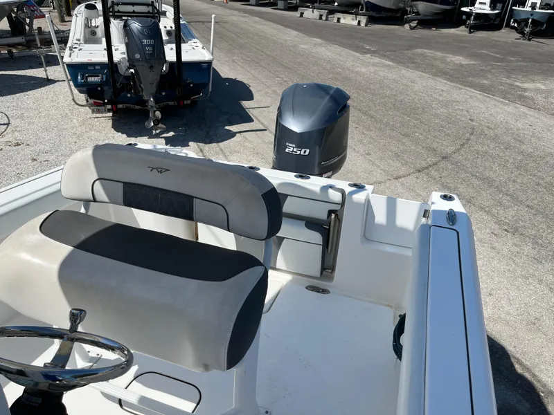 Slide: The Image of 2018 Tidewater 232 CC Adventure boat with 250 HP engine, parked on a lot. - 8