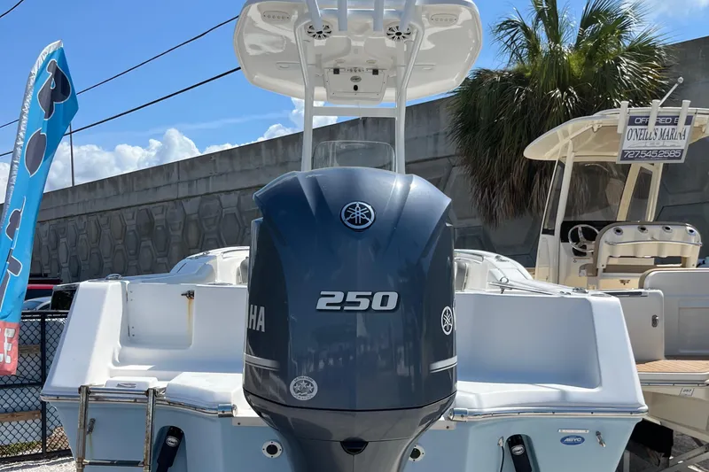 Slide: The Image of 2018 Tidewater 232 CC Adventure boat with Yamaha 250 engine, displayed outdoors. - 9