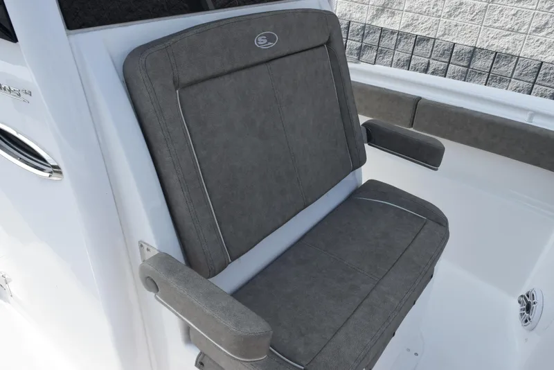 Slide: The Image of Gray cushioned seat on 2025 Sea Hunt Ultra 305 SE boat, featuring armrests and sleek design. - 12