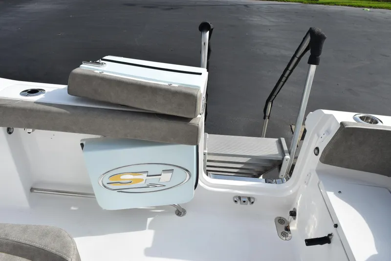 Slide: The Image of 2025 Sea Hunt Ultra 305 SE boat interior with seating and ladder. - 22