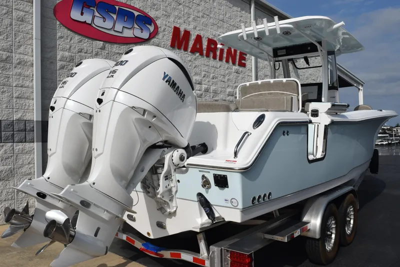 Slide: The Image of 2025 Sea Hunt Ultra 305 SE boat with twin Yamaha engines on a trailer at GSPS Marine. - 4