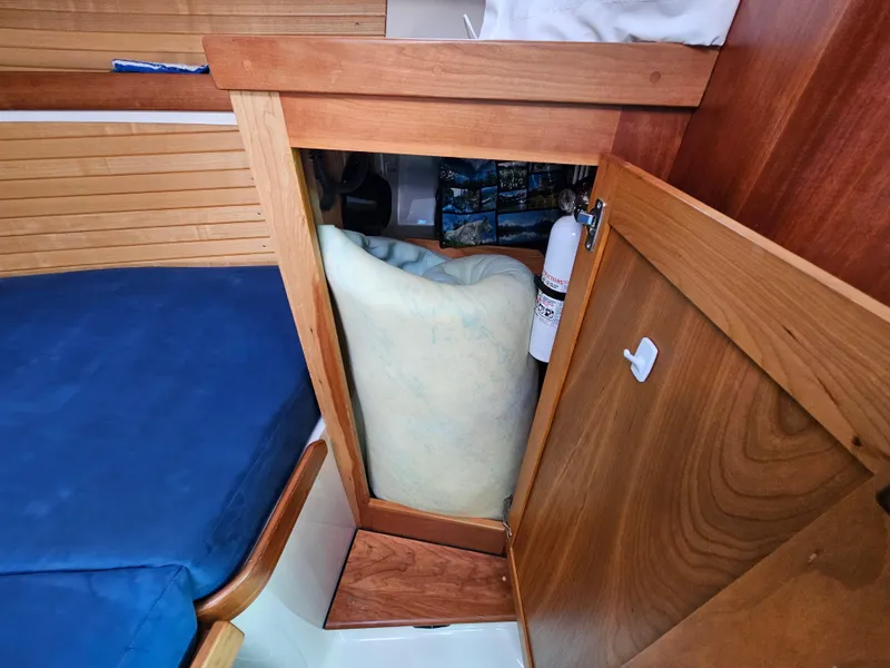 Slide: The Image of Wooden cabinet interior on a 2008 Back Cove 33 Express boat. - 43