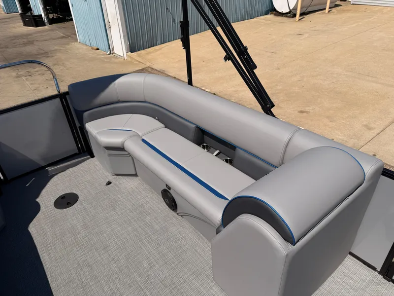 Slide: The Image of 2025 Bentley Pontoons Bolt 223 interior with gray seating and blue accents. - 13