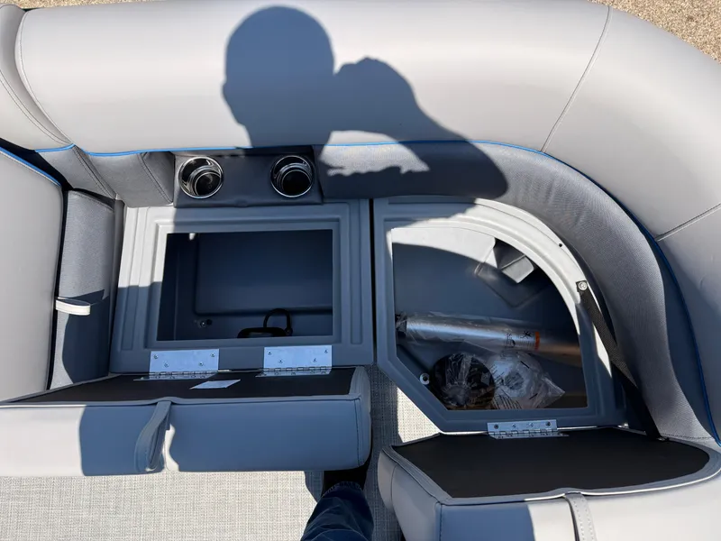 Slide: The Image of 2025 Bentley Pontoons Bolt 223 interior storage compartments with gray upholstery. - 16