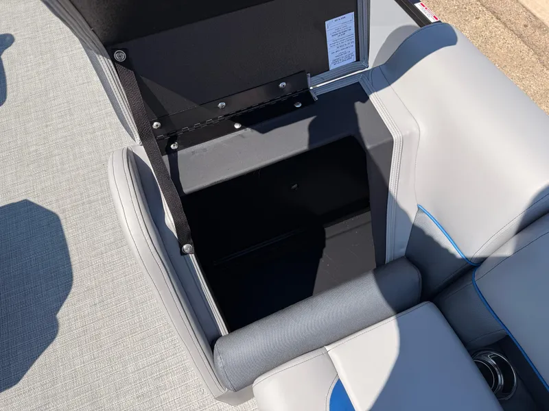 Slide: The Image of 2025 Bentley Pontoons Bolt 223 storage compartment with open lid, showcasing interior space. - 17