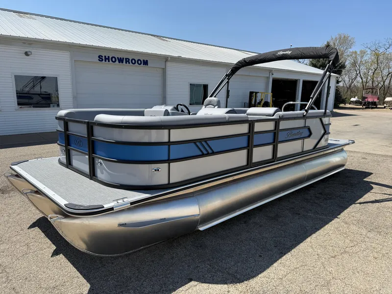 Slide: The Image of 2025 Bentley Pontoons Bolt 223 in showroom, sleek design with blue accents. - 3