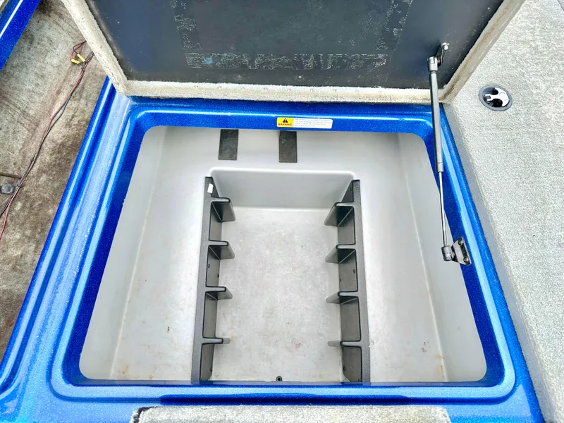 Slide: The Image of Open storage compartment in a 2009 Stratos 294 XL Evolution boat. - 12
