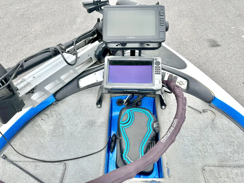 Slide: The Image of 2009 Stratos 294 XL Evolution boat dashboard with dual fish finders and foot pedal. - 16