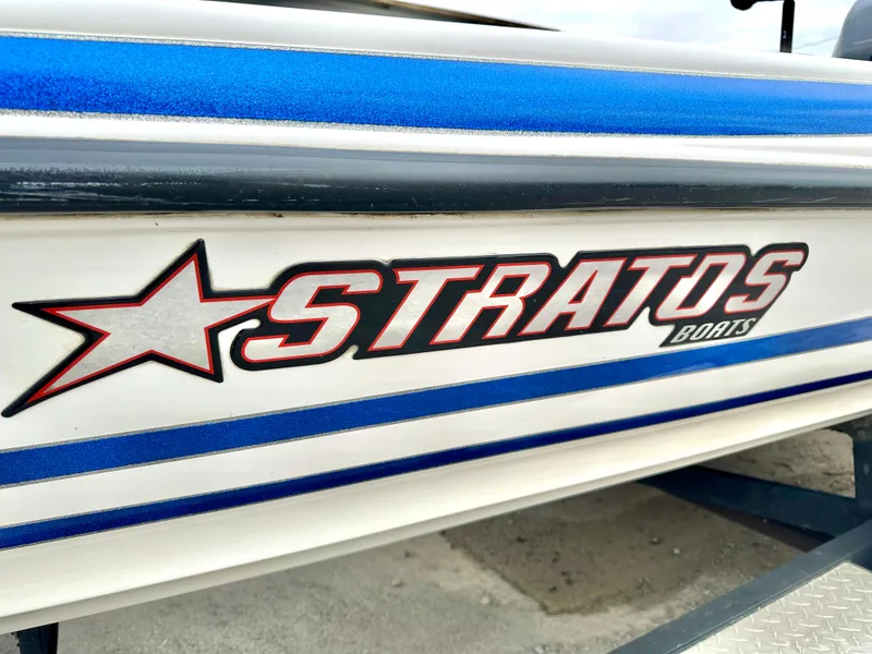 Slide: The Image of Stratos 294 XL Evolution 2009 boat logo with blue and white detailing. - 19