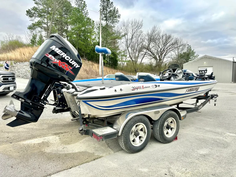 Slide: The Image of 2009 Stratos 294 XL Evolution boat with Mercury engine on trailer. - 4