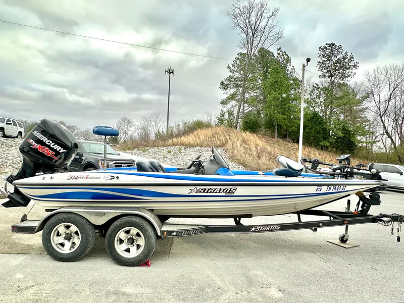 Slide: The Image of 2009 Stratos 294 XL Evolution boat on trailer, parked outdoors, with overcast sky. - 5