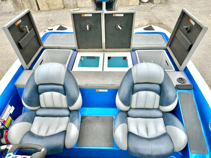 Slide: The Image of 2009 Stratos 294 XL Evolution boat interior with dual seats and storage compartments. - 9