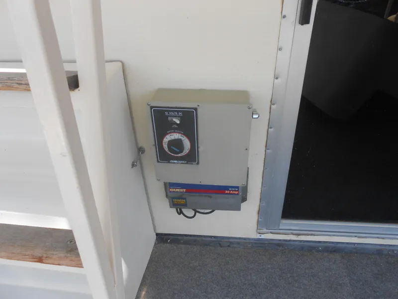 Slide: The Image of Electrical panel on 1984 Boatel Hercules boat, featuring a 12 volts DC system. - 21