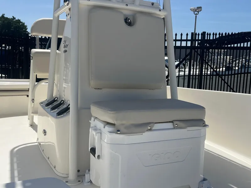Slide: The Image of 2021 Cobia 21 Bay boat interior with seating and storage. - 11