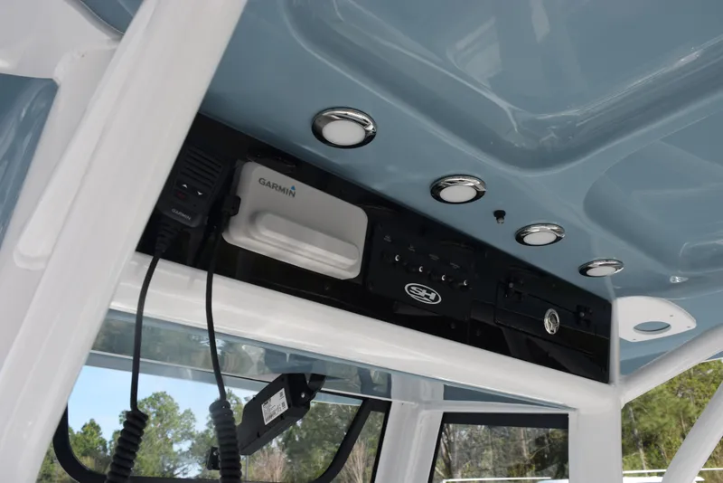 Slide: The Image of 2025 Sea Hunt Ultra 255 SE boat console with Garmin electronics and sleek design. - 10