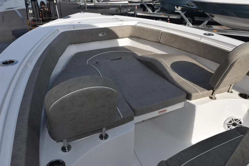 Slide: The Image of 2025 Sea Hunt Ultra 255 SE boat interior with cushioned seating and spacious layout. - 11