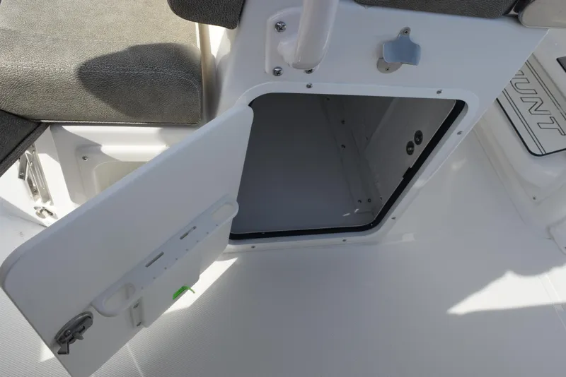 Slide: The Image of Open storage compartment on a 2025 Sea Hunt Ultra 255 SE boat. - 17