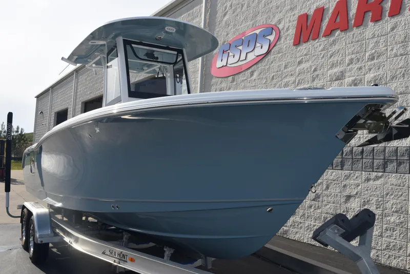 Slide: The Image of 2025 Sea Hunt Ultra 255 SE boat on trailer outside dealership. - 2