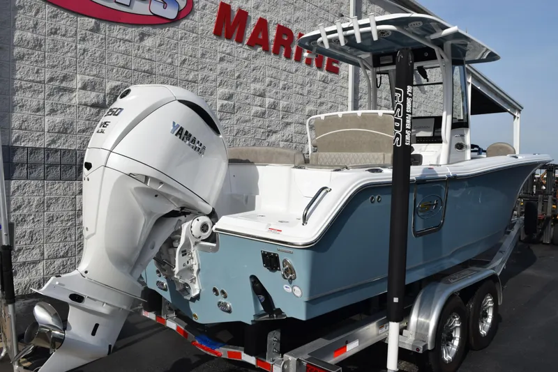 Slide: The Image of 2025 Sea Hunt Ultra 255 SE boat on trailer, featuring Yamaha outboard motor. - 3