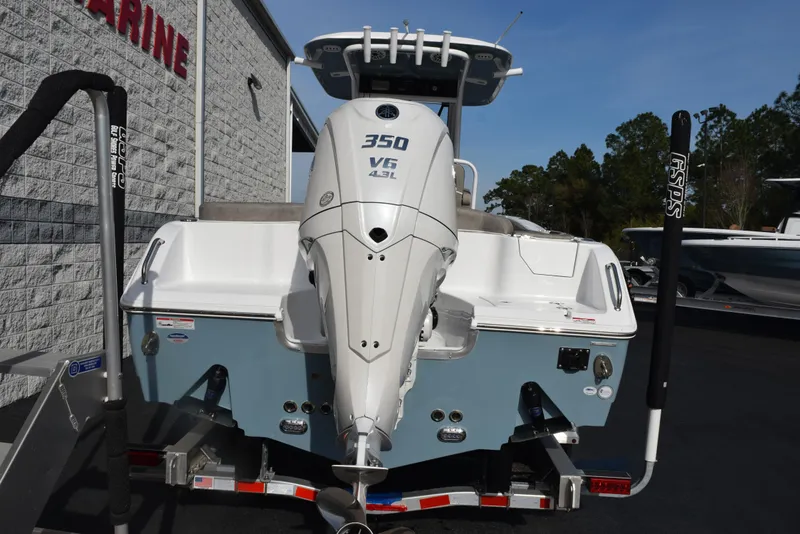 Slide: The Image of 2025 Sea Hunt Ultra 255 SE boat with powerful 350 V6 engine, rear view. - 4