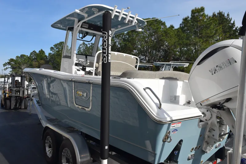 Slide: The Image of 2025 Sea Hunt Ultra 255 SE boat on trailer, featuring Yamaha outboard motor. - 5