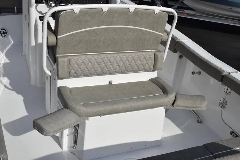 Slide: The Image of 2025 Sea Hunt Ultra 255 SE boat seating with gray upholstery and white deck. - 7