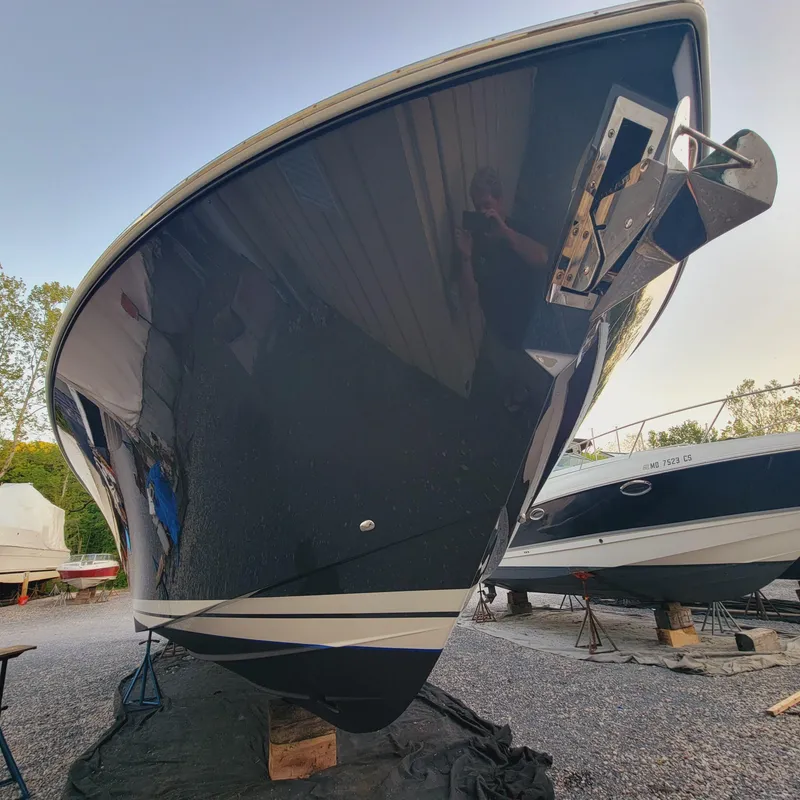 Slide: The Image of 2021 Tiara Yachts 38 LS boat on dry dock, side view. - 32