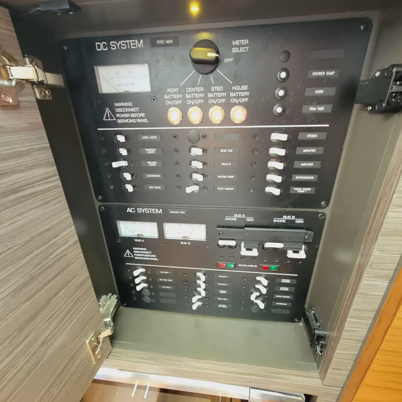 Slide: The Image of Electrical control panel on a 2021 Tiara Yachts 38 LS, featuring DC and AC systems. - 37