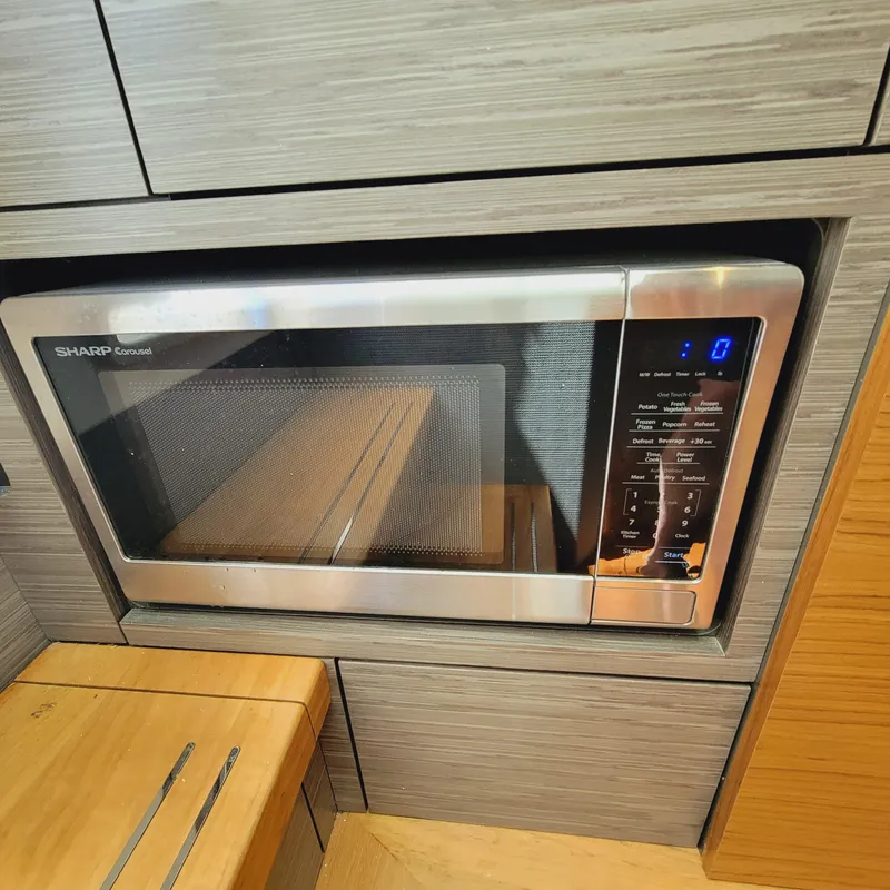 Slide: The Image of Built-in Sharp Carousel microwave in 2021 Tiara Yachts 38 LS kitchen area. - 38