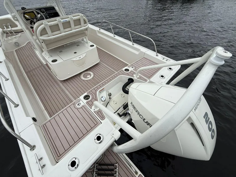 Slide: The Image of 2022 Boston Whaler 210 Montauk boat with Mercury outboard motor on water. - 13