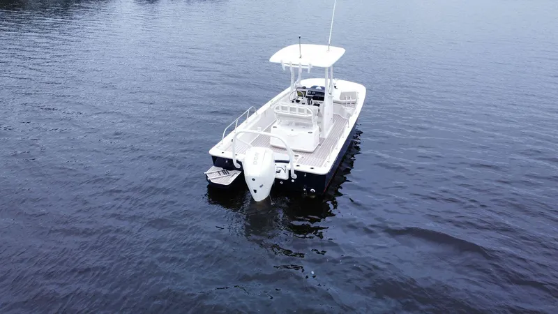 Slide: The Image of 2022 Boston Whaler 210 Montauk boat on calm water, aerial view. - 2