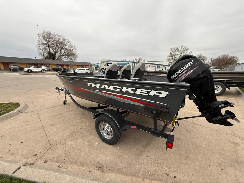 Slide: The Image of 2017 Tracker Pro Guide V-16 SC boat with Mercury engine on trailer. - 5