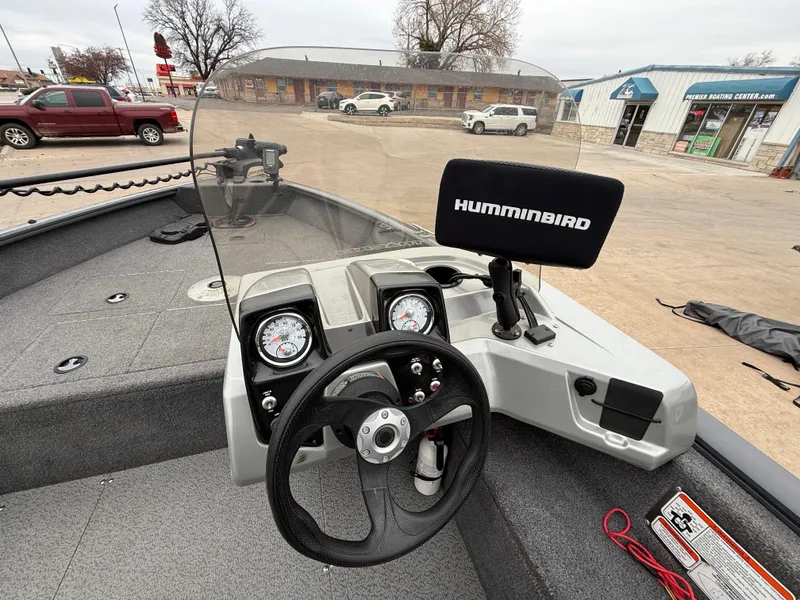 Slide: The Image of 2017 Tracker Pro Guide V-16 SC boat dashboard with steering wheel and Humminbird fish finder. - 6