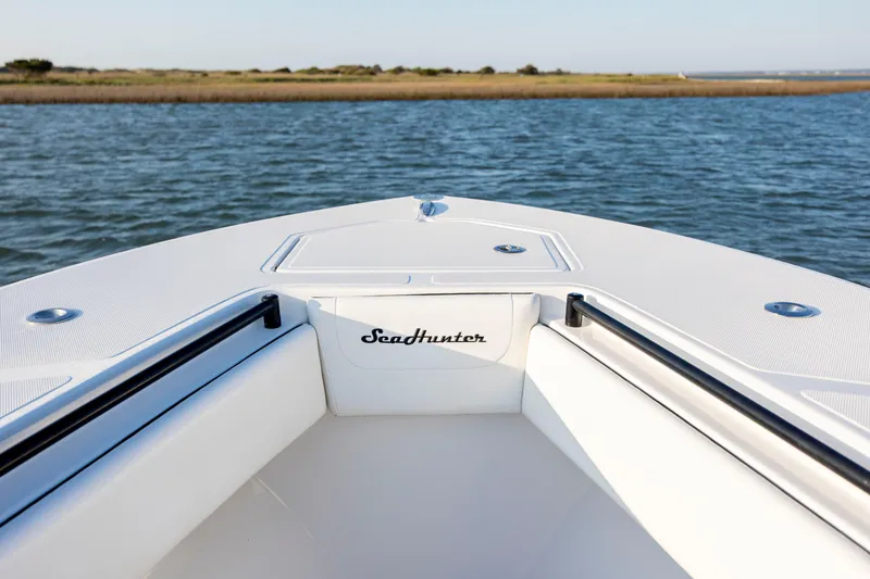 Slide: The Image of Bow view of 2014 SeaHunter 32 Tournament boat on calm water. - 11