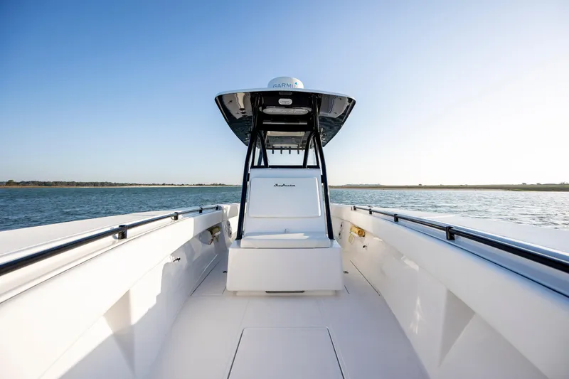 Slide: The Image of 2014 SeaHunter 32 Tournament boat on calm water under clear blue sky. - 12