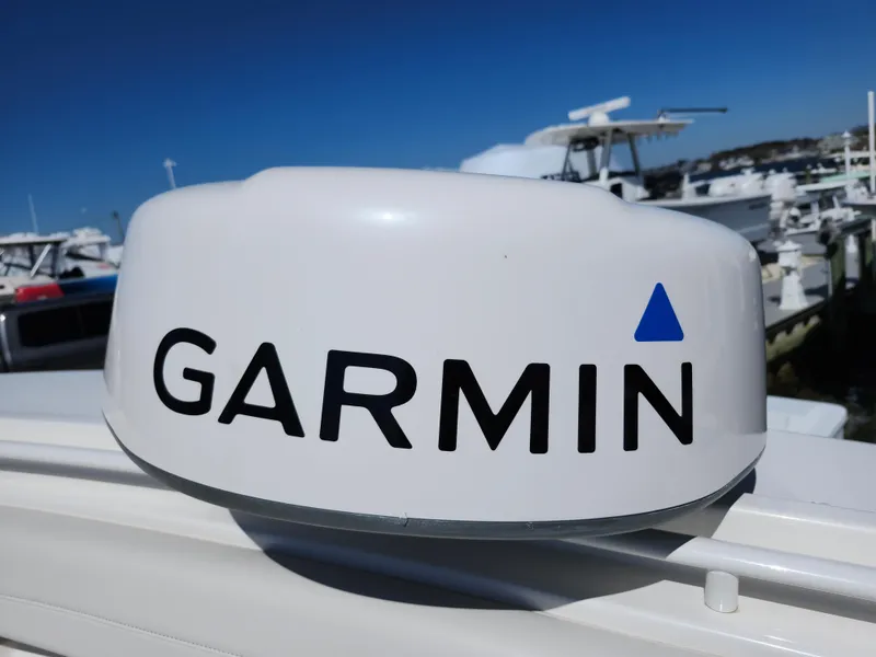 Slide: The Image of Garmin radar on 2020 Regulator 25 boat, docked with other vessels in background. - 25