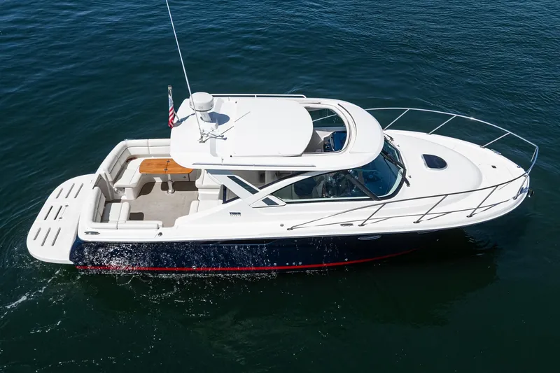 Slide: The Image of 2018 Tiara Yachts 3100 Coronet cruising on open water, side view. - 12