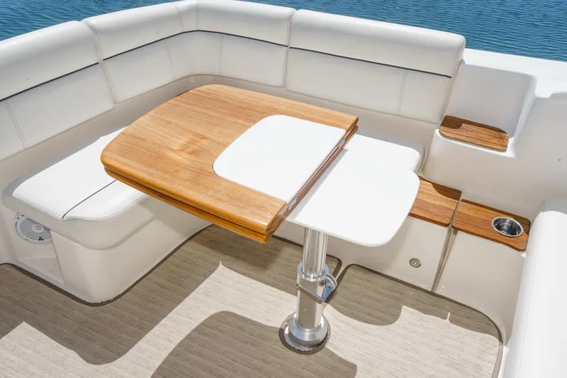 Slide: The Image of Luxurious seating area on 2018 Tiara Yachts 3100 Coronet with elegant wooden table. - 27